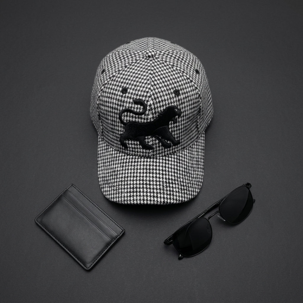 Minimalist flat lay featuring the Houndstooth Classic Wool Cap and stylish modern accessories