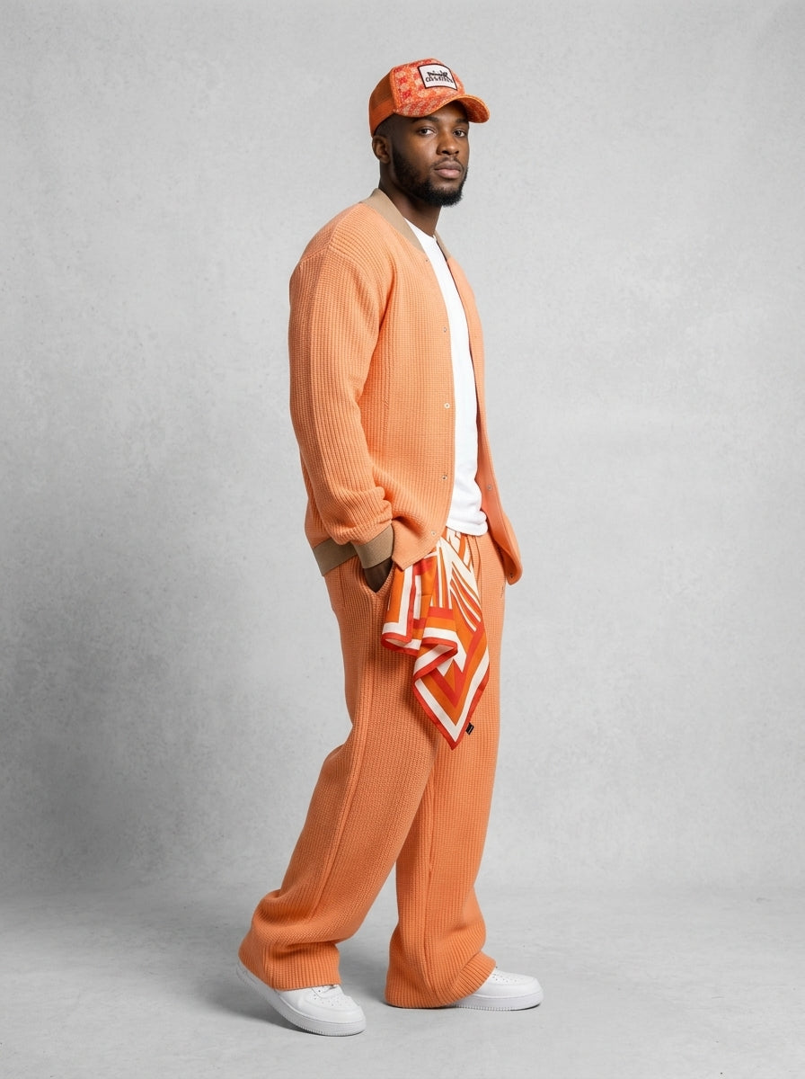 Model wearing Krischen Peach Knit set three-quarter profile view