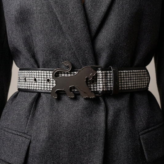Lifestyle view of the houndstooth statement belt styled over a charcoal gray blazer