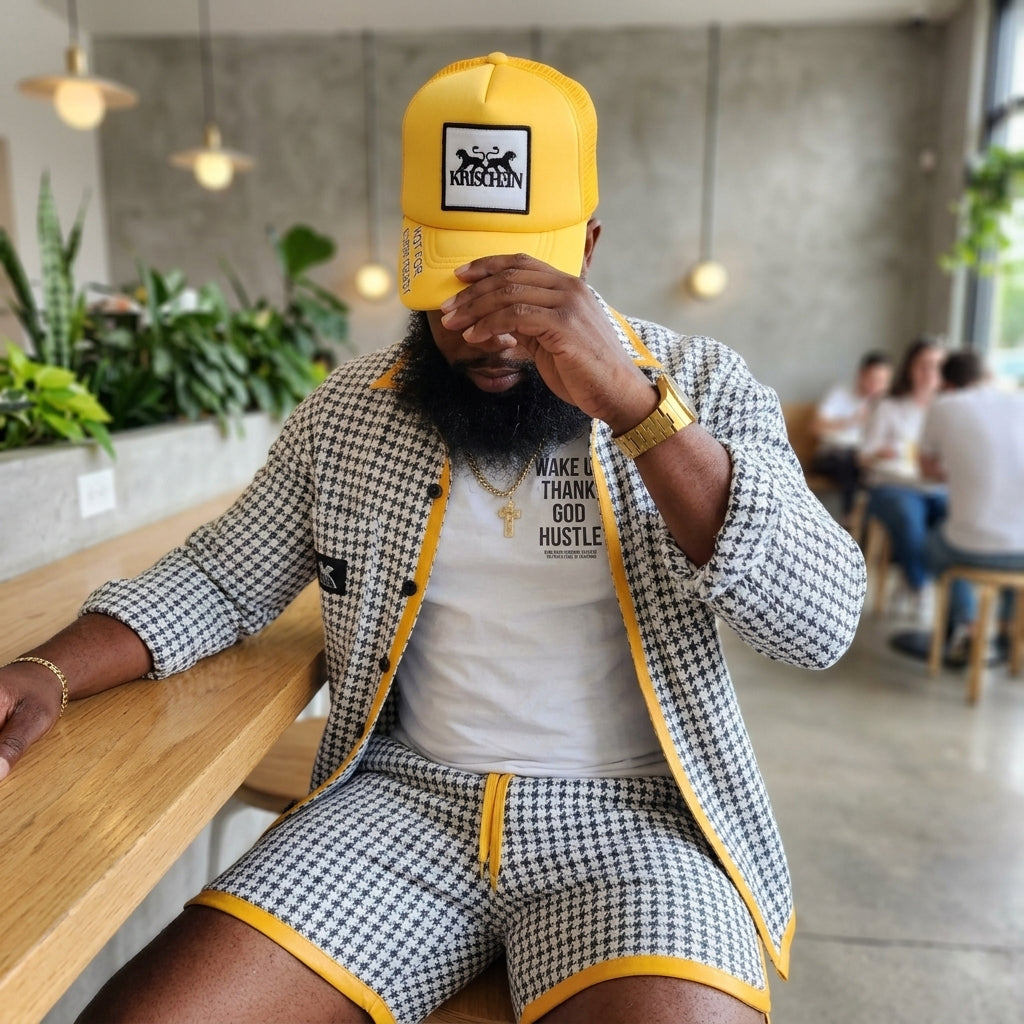 Lifestyle model wearing the Houndstooth Classic Jacket and Shorts set in a cafe setting